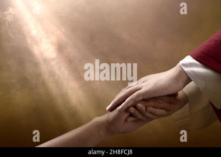 Jesus Christ gave his help to his follower with dramatic background Stock Photo