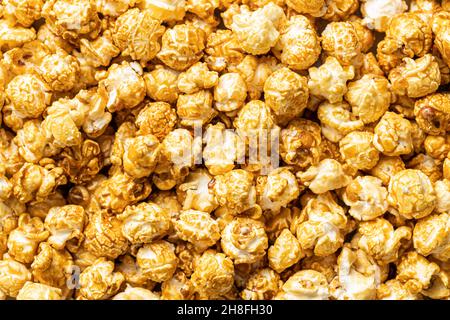 A lots of sweet caramel popcorn. Top view. Stock Photo