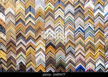 Colorful set samples baguette frames molding for picture on wall. Stock Photo