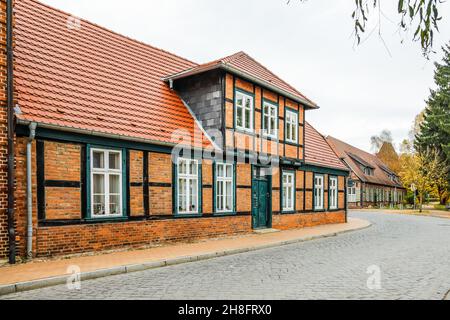 Restored Half-timbered House Made Of Bricks On Ludwigsluster Canal In Autumn, Mecklenburg-Western Pomerania, Germany Europe Stock Photo