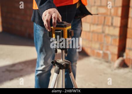 Laser level being used in professional construction process Stock Photo