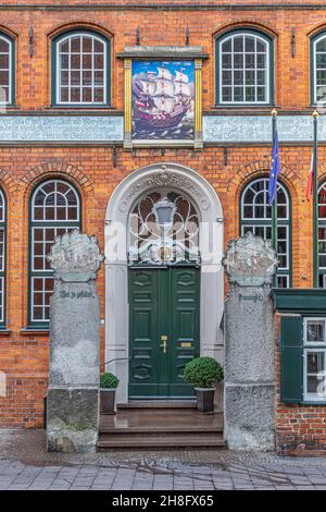 The facade of the historic building that housed the Schiffergesellschaft, a historic maritime association, currently houses a restaurant. Germany Stock Photo