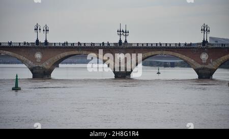 Bordeaux, France - 8 Nov, 2021 Pont de Pierre bridge, over the Garonne river in Bordeaux, Nouvelle Aquitane, Gironde