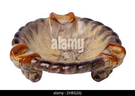 Antiques and art. Close-up of an ancient red brown ceramic ashtray isolated on a white background. Macro. Stock Photo