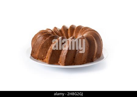 Traditional bundt cake piece with raisins isolated on white background Stock Photo
