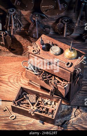 Locksmiths workshop with tools to repair. Forgotten locksmiths workplace. Forgotten craft profession. Stock Photo