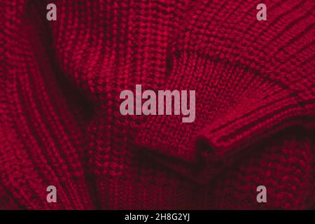 Closeup of red sweater texture. Background for advertising with copy space. Stock Photo