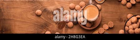 Dutch holiday Sinterklaas. kruidnoten cookies sweets, chocolate . Children party Saint Nicholas day five december. espresso coffee and sweets. space for text. banner long format Stock Photo