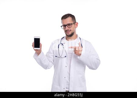Doctor Pointing at Phone Isolated. Man Doctor Phone in Hands Stock Photo