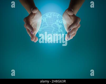 Woman's hands holding the earth globe on a blue background. Global business concept. Stock Photo