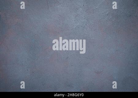 Dark concrete background with small scratches of color. Top view, horizontal, copy space. Stock Photo