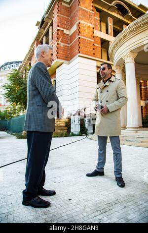 Amazing two senior businessmen are talking about the company plans while smiling Stock Photo