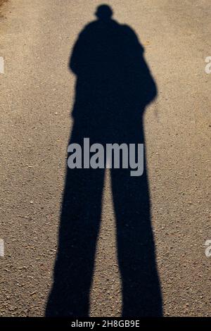 Shadow of a man on the ground texture Stock Photo - Alamy