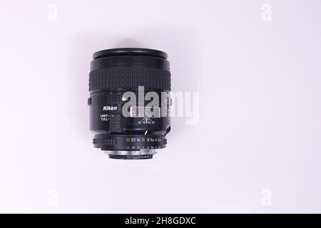Paris, France - November 30, 2021 : Closeup of the vintage nikkor lens 60 millimeter on a white background Stock Photo
