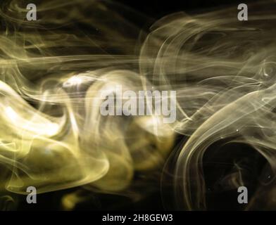 Flowing yellow smoke background. Abstract fog texture backdrop photo Stock Photo