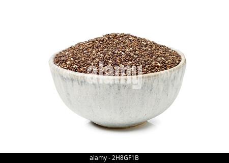 Chia seeds in ceramic bowl on white background Stock Photo