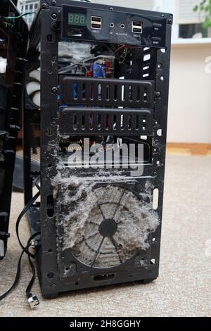 dirty computer case.Dust layer on the system unit.Time to clean your computer from home dust.dust is the killer of electrical engineering. Stock Photo