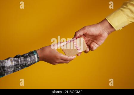 men hand giving homemade gift box  Stock Photo