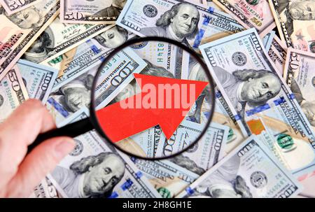 Magnifying Glass on the American Dollars Background with Arrow Up