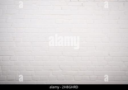 White brick wall background abstract texture of painted genuine clay blocks of masonry work Stock Photo