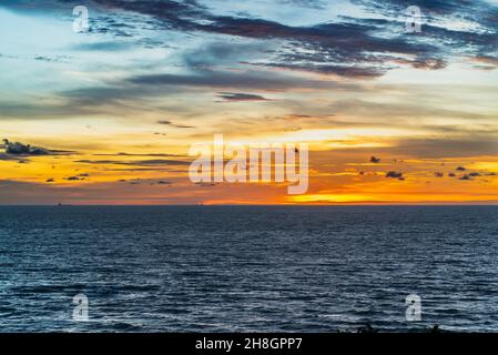 Dramatic clouds and sunset sky over the sea with colourful clouds in Port Dickson, Malaysia. Stock Photo