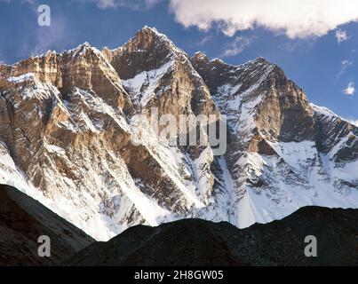 morning view of Lhotse and clouds on the top - way to mount Everest base camp, Khumbu valley, Sagarmatha national park, Nepalese Himalayas Stock Photo