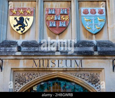 Winchester, UK - November 28th 2021: Sign and coat of arms badges above the entrance to the Winchester City Museum in the city of Winchester in Hampsh Stock Photo