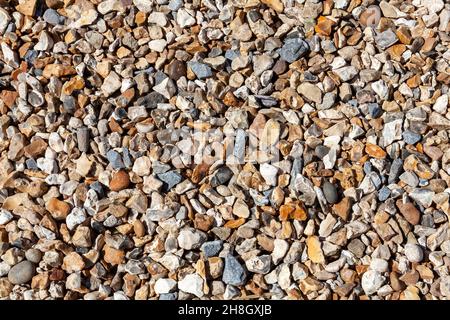 Gravel background of rock pebble stones used for landscaping and pathways in gardens with a nice texture pattern, stock photo image Stock Photo