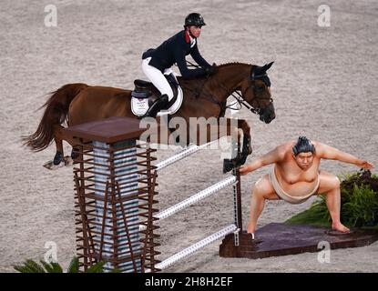 File photo dated 04-08-2021 of Great Britain's Ben Maher riding Explosion W. The 38-year-old British rider produced a dazzling performance under the Tokyo Equestrian Park floodlights four months ago, powering to a stunning Olympic title success aboard aptly-named Explosion W. Issue date: Tuesday November 30, 2021. Stock Photo