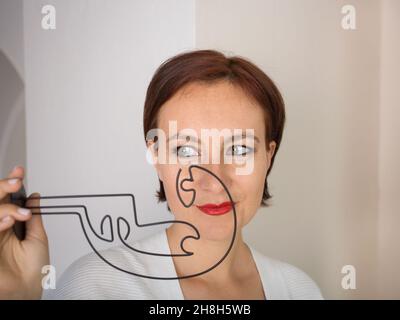 facial portrait of a woman of 35 - 40, mysterious in search of a solution. indecision, reflection, doubt. Looking away Stock Photo