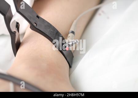 ECG lead clip on the patient wrist close-up. Stock Photo