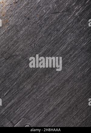 Striped metallic texture with scratches of different depths. Stock Photo