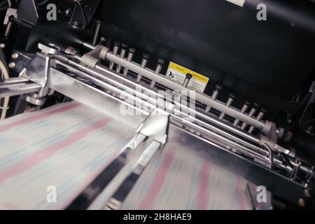 Blurred paper in motion during printing process. Stock Photo