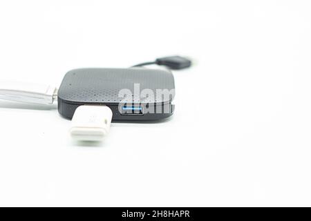 External USB hub and usb flash drives on white background Stock Photo