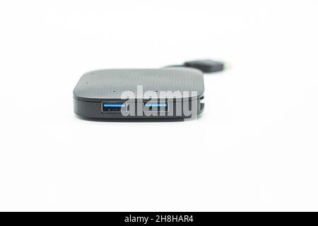External USB hub and usb flash drives on white background Stock Photo