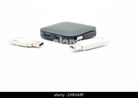 External USB hub and usb flash drives on white background Stock Photo