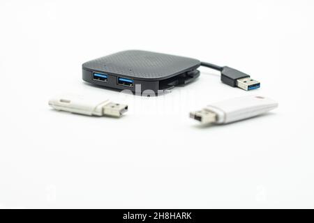 External USB hub and usb flash drives on white background Stock Photo