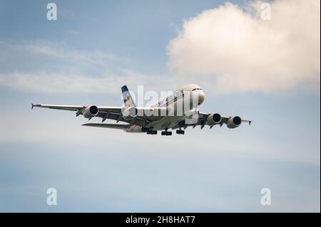 29.11.2021, Singapore, Republic of Singapore, Asia - Singapore Airlines (SIA) Airbus A380-800 passenger aircraft approaches Changi Airport for landing. Stock Photo