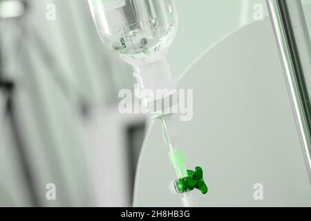 IV drip bottle hanging on the medical pole. Stock Photo