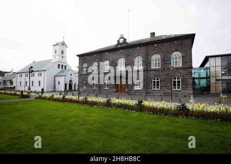 Reykjavik, Iceland. 08th Sep, 2021. The building of the Icelandic Parliament (r) next to the Cathedral (Domkirche) in downtown Reykjavik. Credit: Christian Charisius/dpa/Alamy Live News Stock Photo