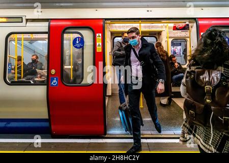 People Getting Off A London Underground Train, London, UK. Stock Photo