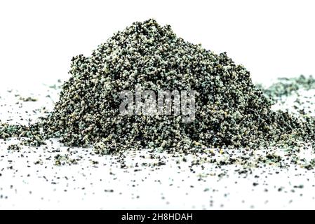 A background made out of a heap inside a filter with activated carbon and water filtration beads, isolated on a white background. Stock Photo