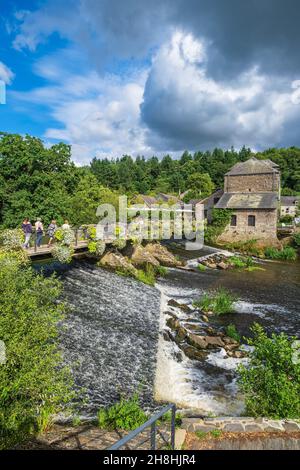 France, Morbihan, La Gacilly, footbridge over the Aff river and Yves Rocher House Stock Photo