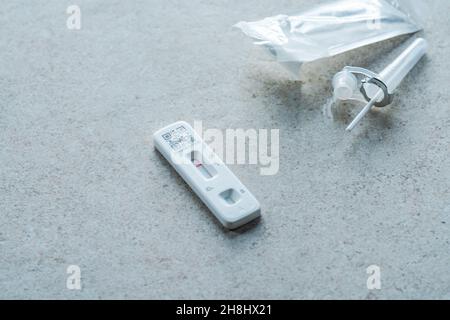 Rapid lateral flow test device shows negative coronavirus result. Stock Photo