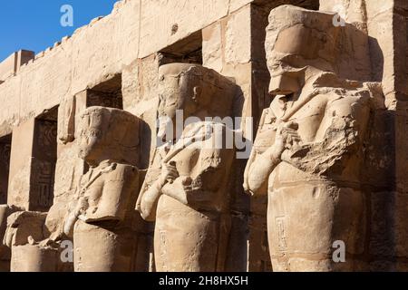 Mysterious engraved figures on the Karnak temple wall. Stock Photo