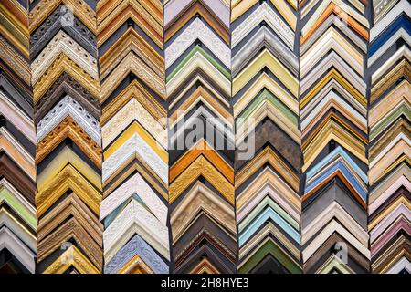 Colorful set samples baguette frames molding for picture on wall. Stock Photo