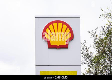 Logo of oil company Royal Dutch Shell at a gas station Stock Photo