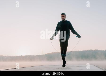 Man jumping rope in the morning. Stock Photo