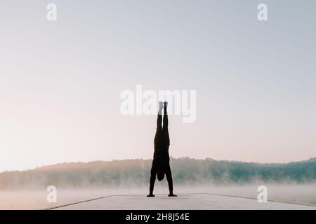 Man in the morning doing exercises. Stock Photo