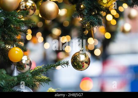 London, UK.  30 November 2021. Baubles on Christmas trees outside Harvey Nichols in Knightsbridge on the first day that face coverings are again required in shops following the UK government’s new measures to try to curb the spread of coronavirus following the detection of the Omicron variant.  Credit: Stephen Chung / Alamy Live News Stock Photo
